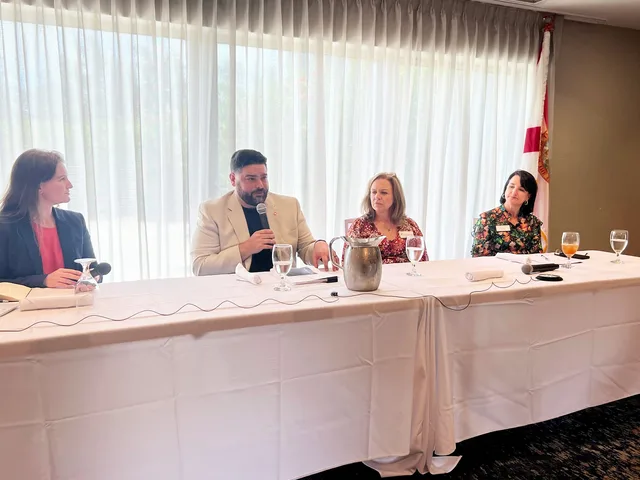 Eddie Gonzalez Loumiet participating in a professional panel discussion at a leadership event