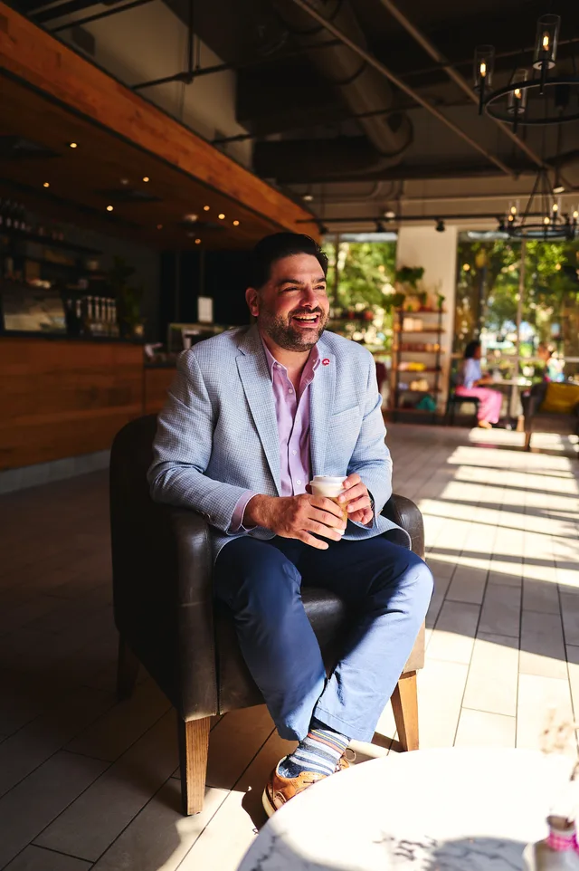 Eddie Gonzalez Loumiet having a coffee meeting and conversation with a community leader