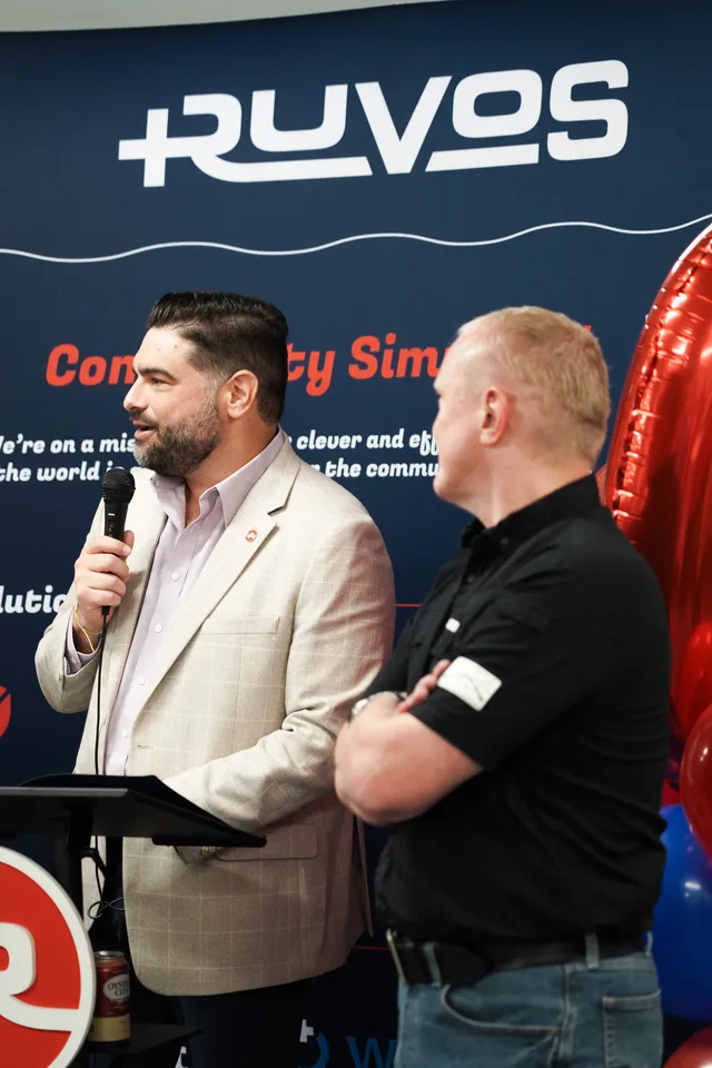Eddie Gonzalez Loumiet speaking at a Ruvos company event in front of an audience