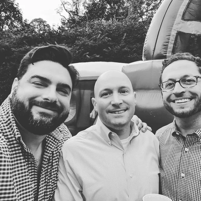 Eddie Gonzalez Loumiet with longtime friends at a social gathering in Tallahassee
