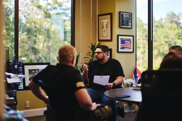 Eddie Gonzalez Loumiet leading a team meeting at the Ruvos office