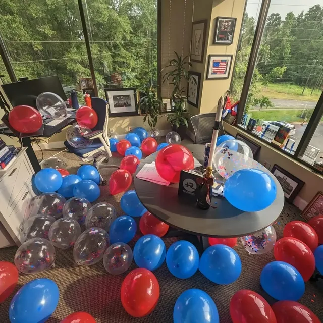 Eddie Gonzalez Loumiet celebrating a milestone with the Ruvos team at the office